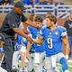 Lions QB Matthew Stafford shakes hands with head coach Jim Caldwell at Ford Field in 2016.
